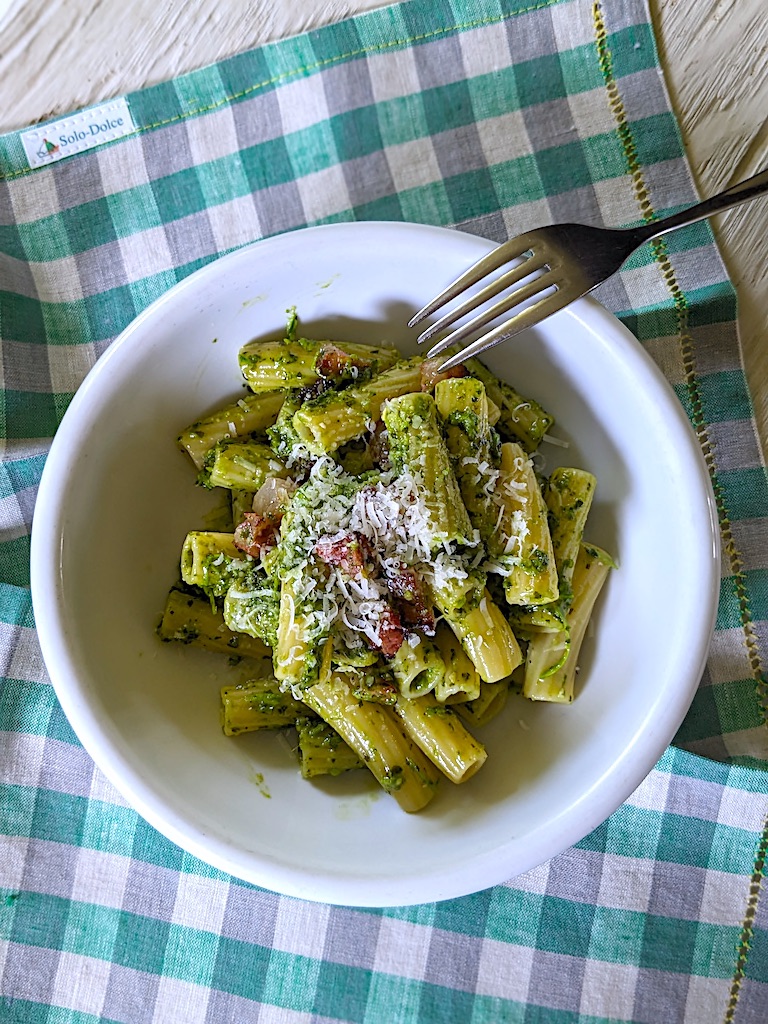 Pasta with basil pesto, talli di aglio and guanciale 